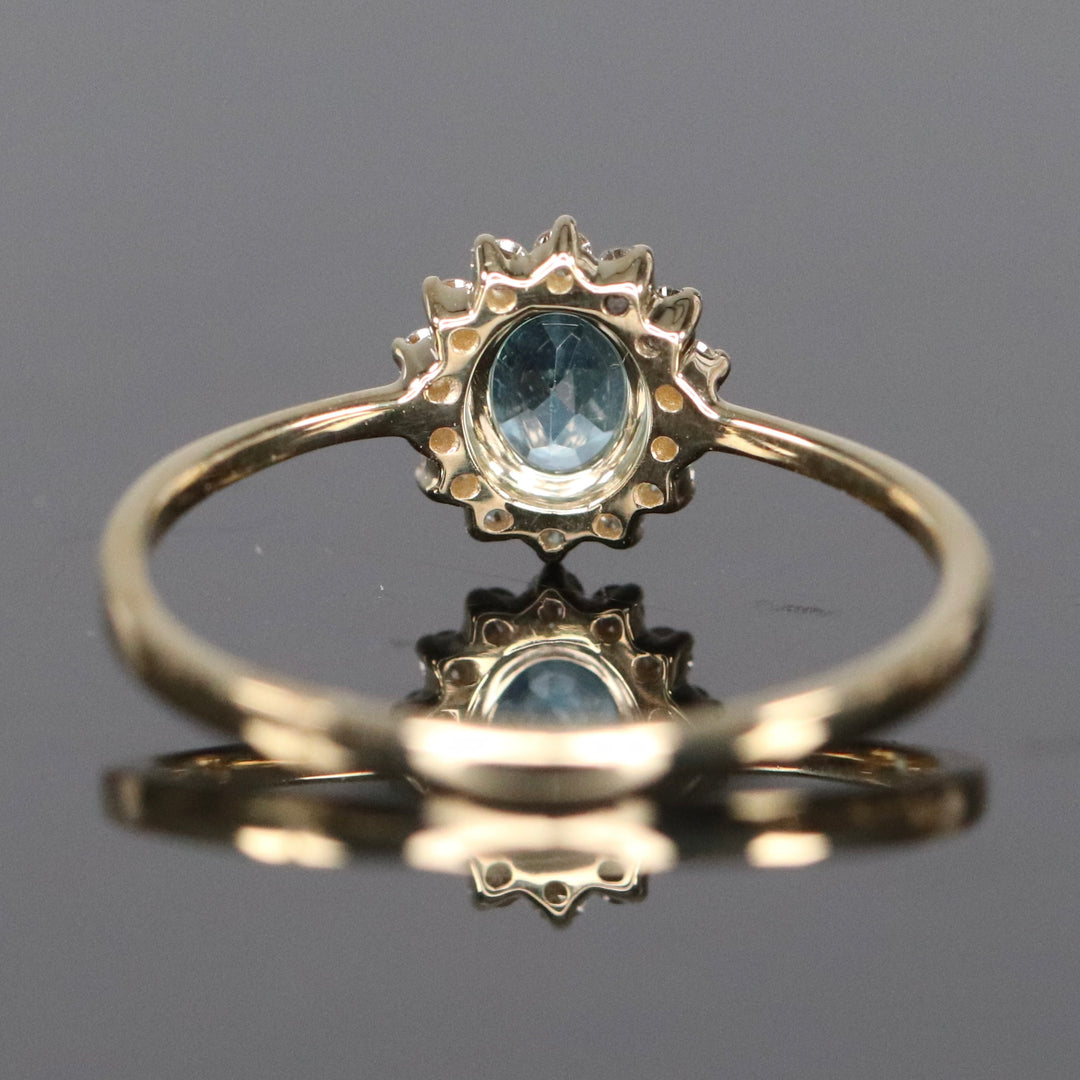 Blue topaz and diamond ring in yellow gold