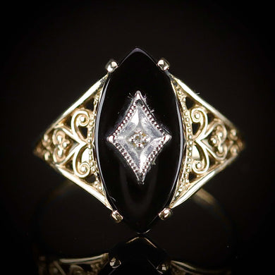 Vintage navette onyx and diamond ring in yellow gold