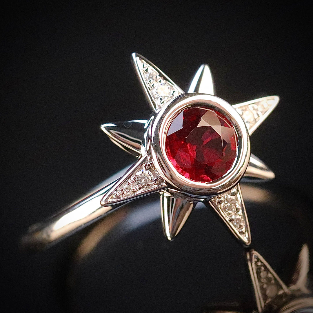 Ruby and diamond compass ring in 14k white gold from Manor Jewels