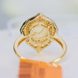 Opal, sapphire, tsavorite, and diamond ring in 14k yellow gold by Effy