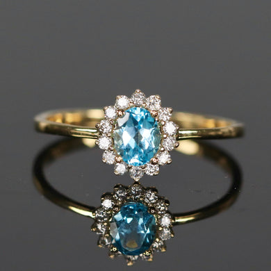 CLEARANCE!  Blue topaz and diamond ring in yellow gold