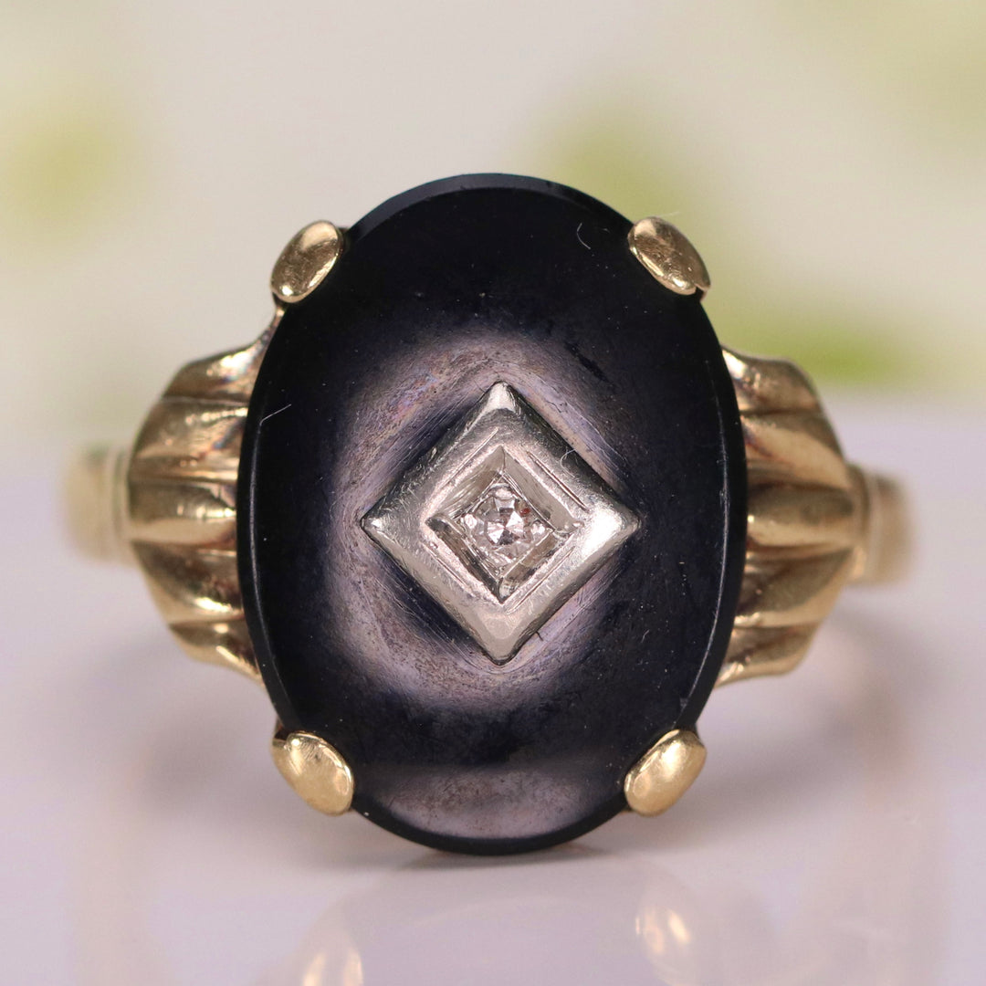 Vintage onyx and diamond ring in yellow gold