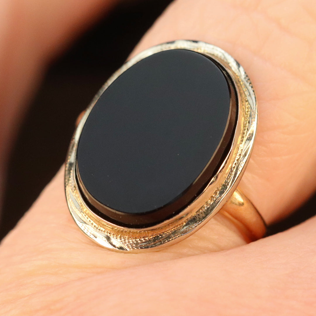 Classic oval onyx vintage ring in yellow and white gold