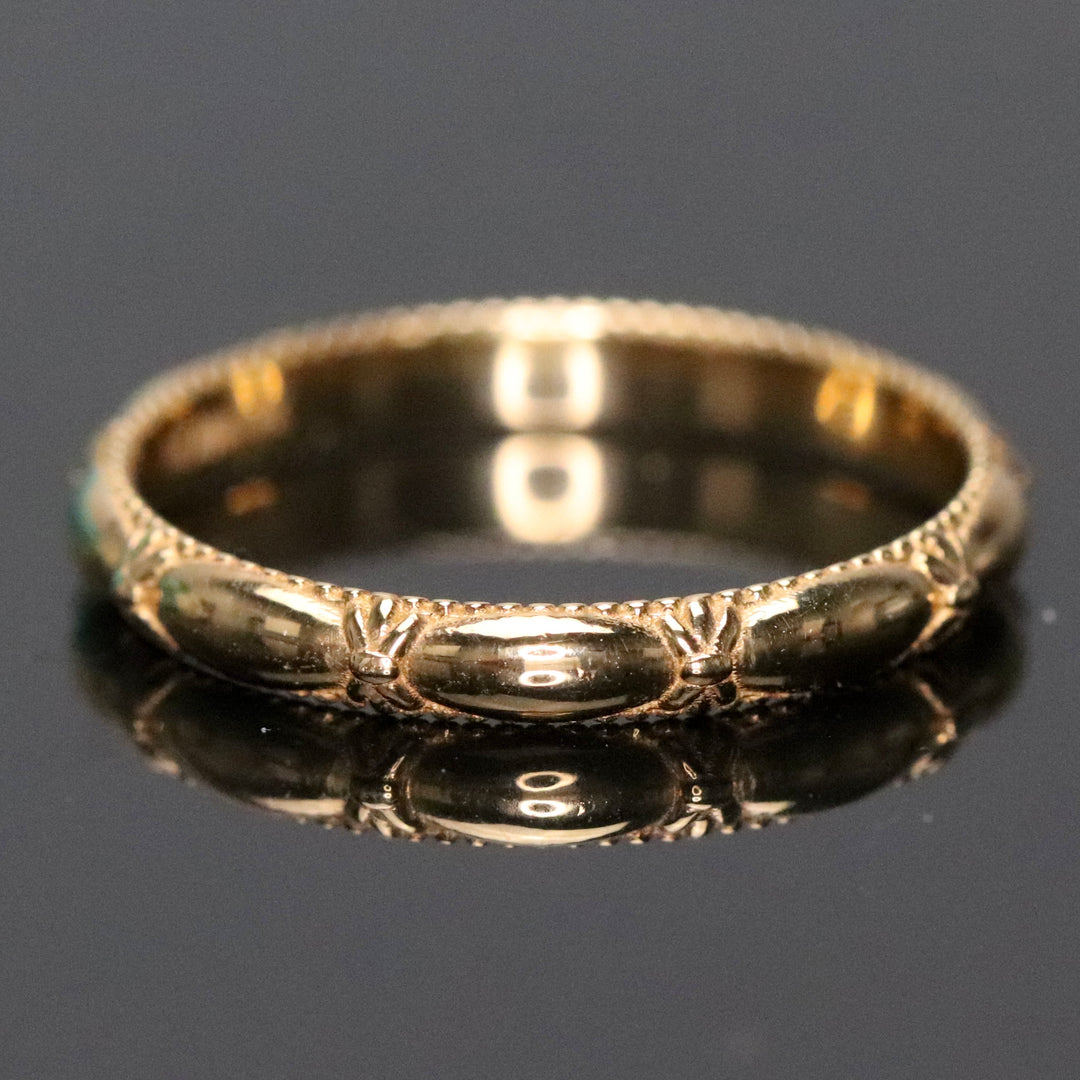 Vintage ring band patterned in 14k yellow gold