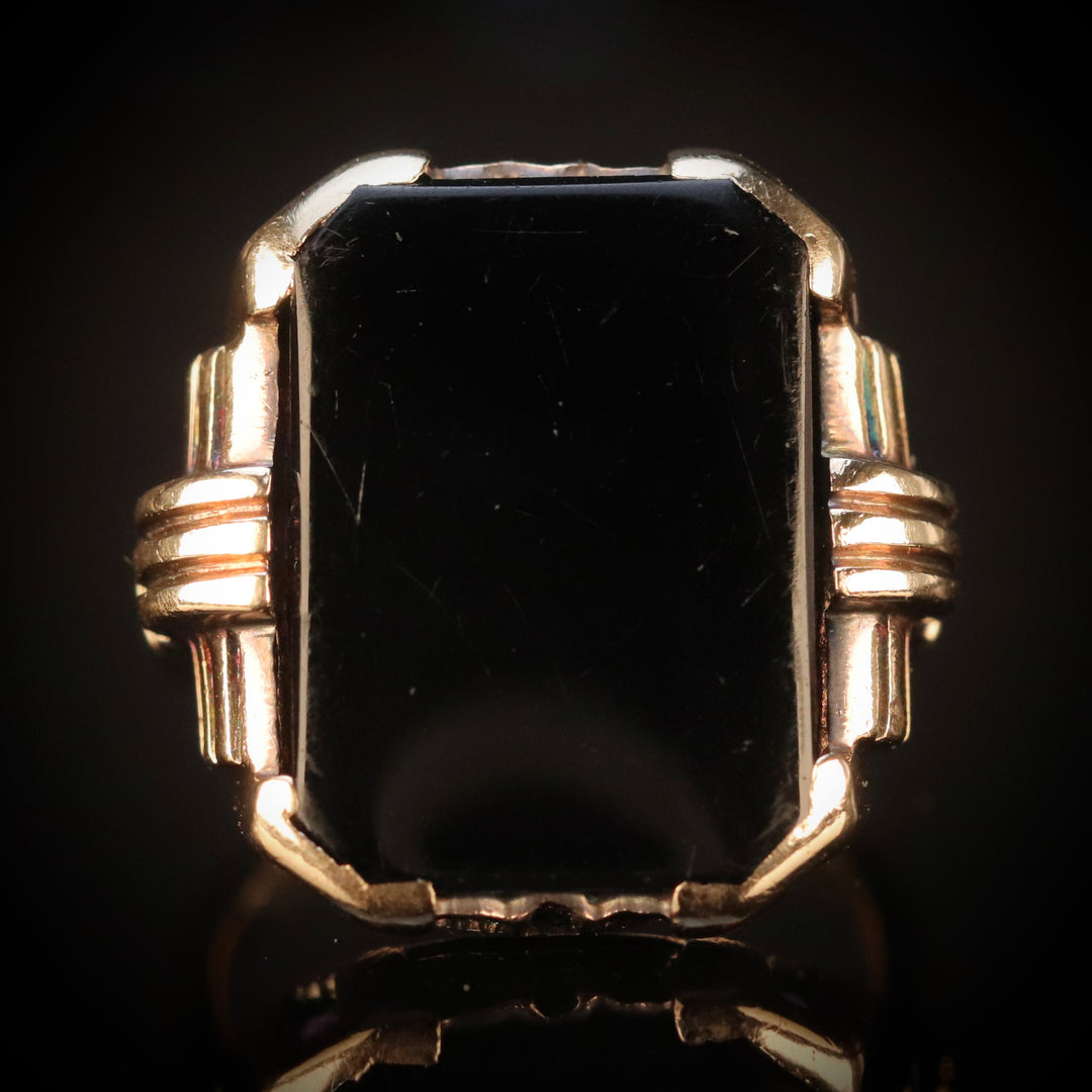Heavy vintage onyx ring in yellow gold