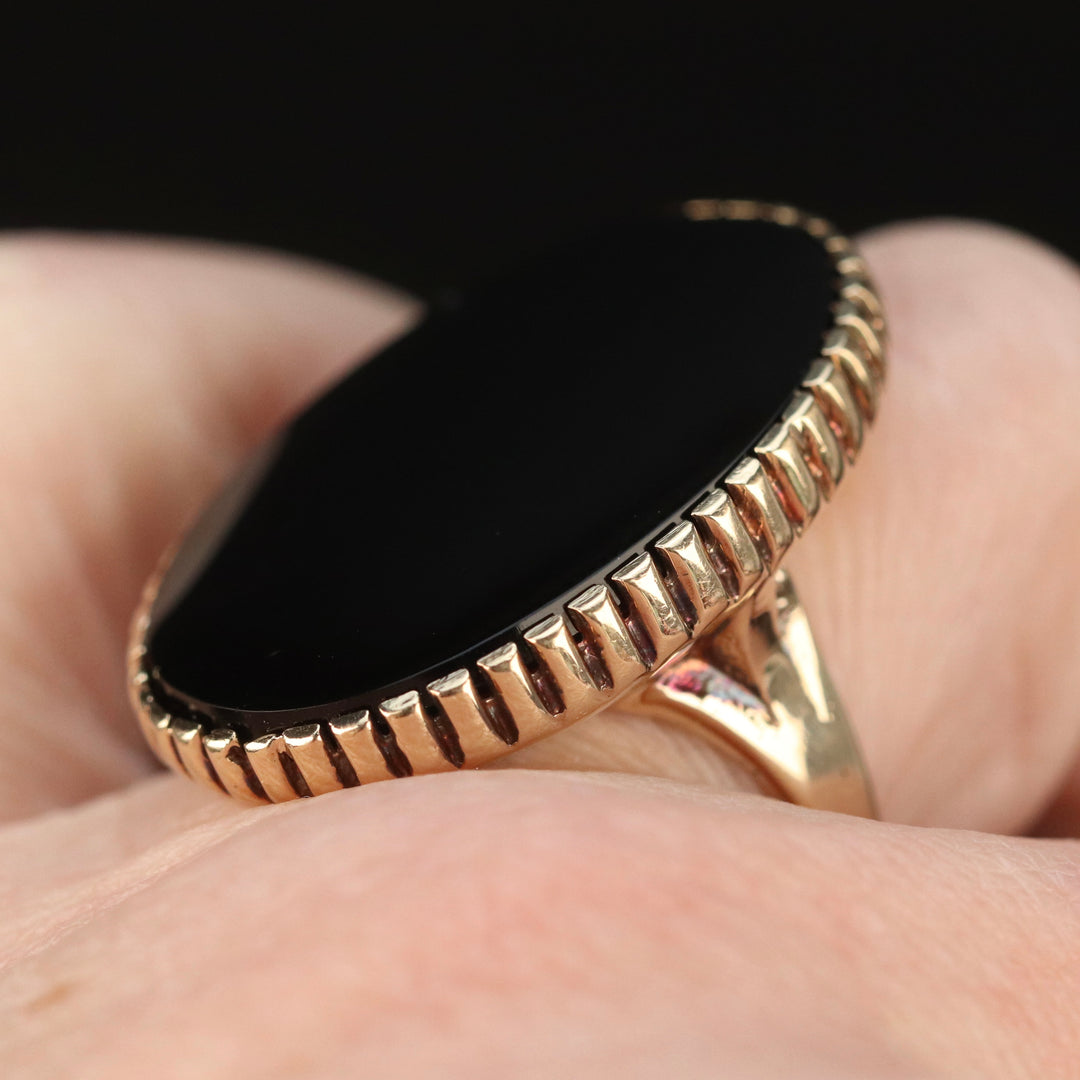Vintage onyx ring with large oval onyx in 14k yellow gold from Manor Jewels.
