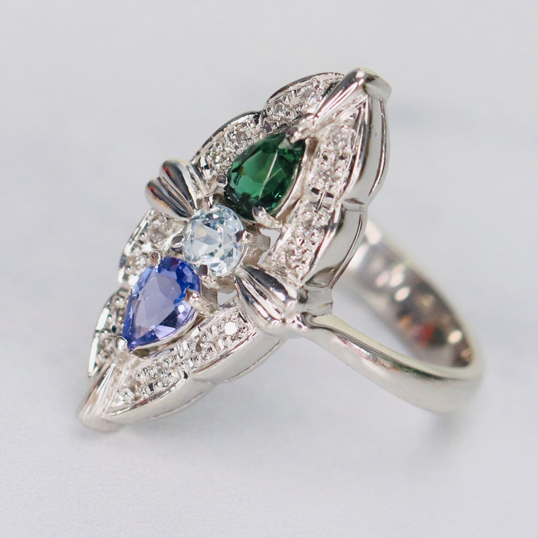 Estate platinum navette ring with diamonds, aquamarine, tanzanite, and tourmaline in platinum from Manor Jewels