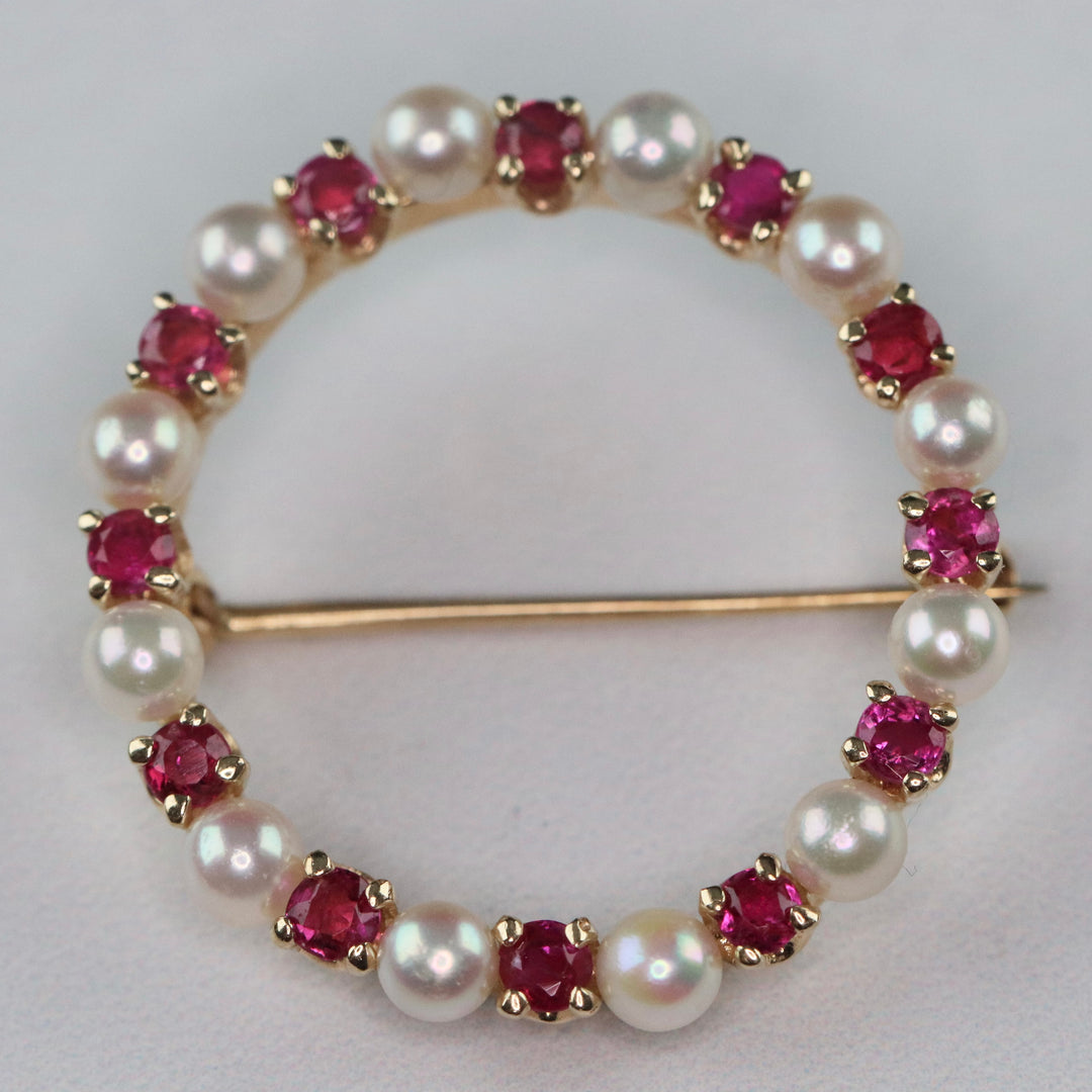Ruby and pearl wreath brooch in 14k yellow gold
