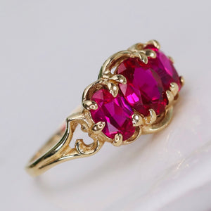 Vintage synthetic pink sapphire 3 stone ring in yellow gold