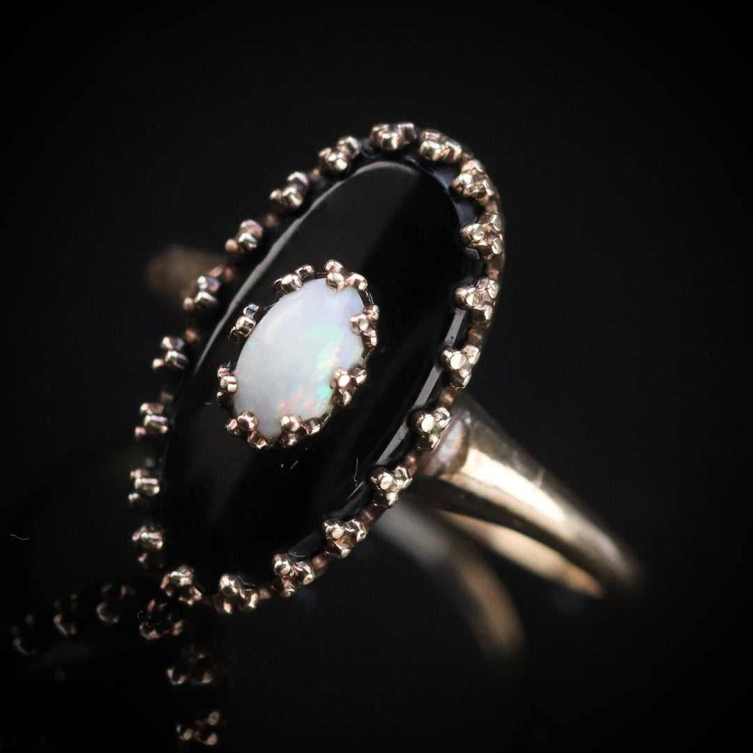 Vintage onyx ring with opal in yellow gold from Manor Jewels.