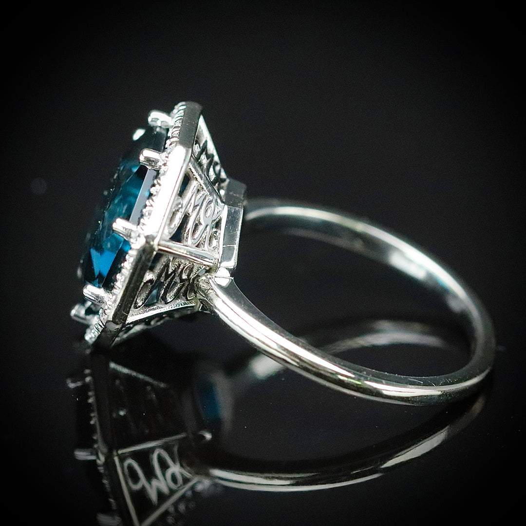 Custom London Blue topaz and diamond ring in 14k white gold