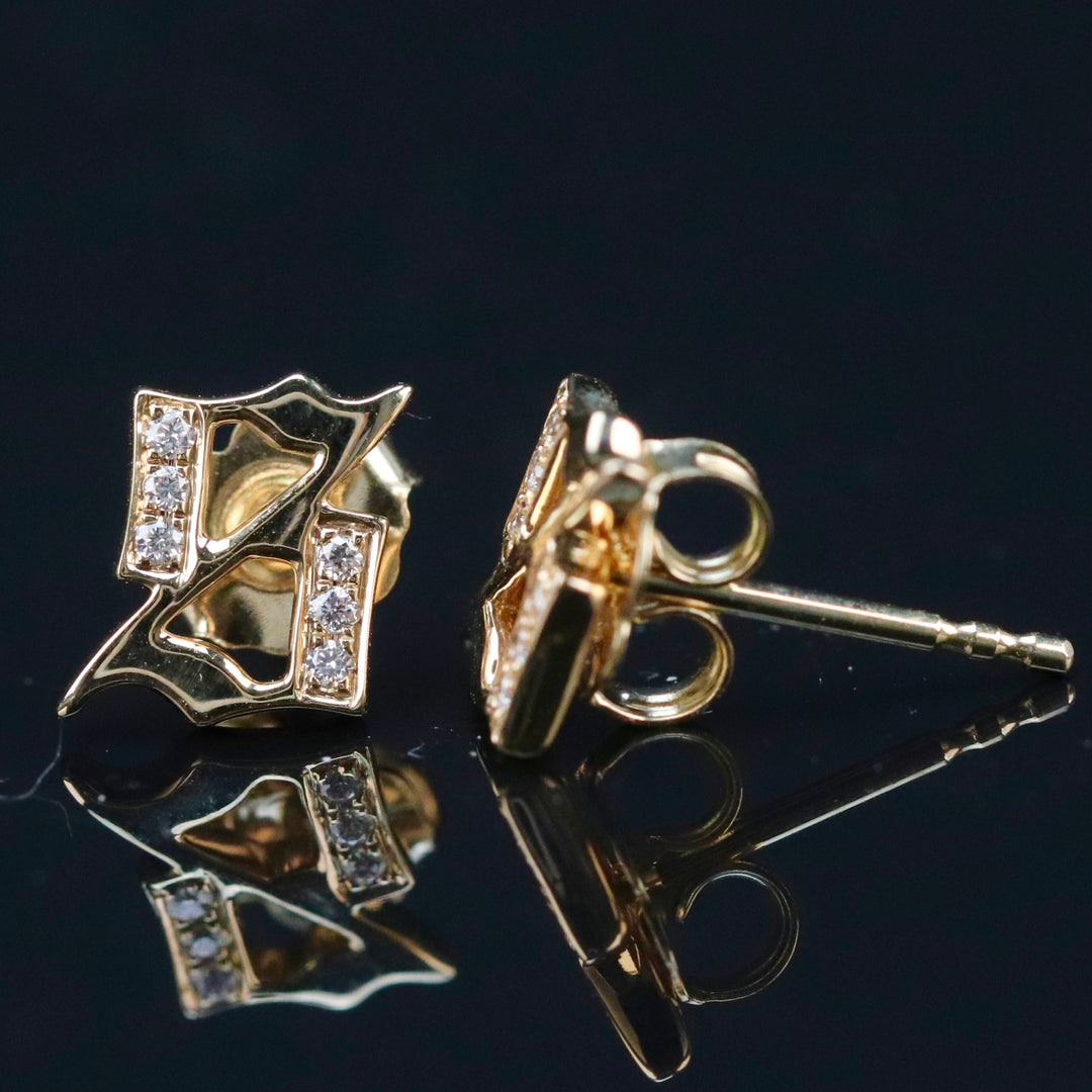 Gothic Letter S diamond studs in 14k yellow gold