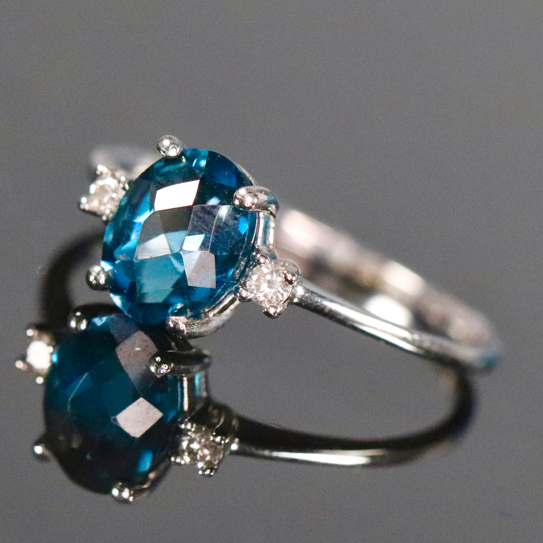 Blue topaz and diamond ring in 14k white gold