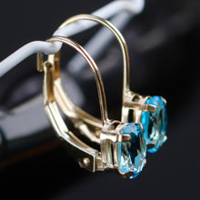 Load image into Gallery viewer, Blue topaz leverback earrings in yellow gold