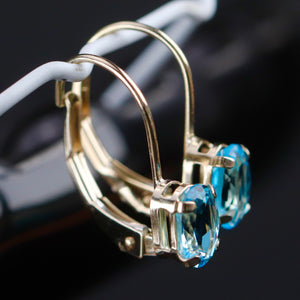 Blue topaz leverback earrings in yellow gold