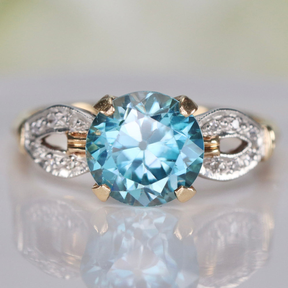 Vintage ring with blue zircon and diamonds in 14k yellow gold
