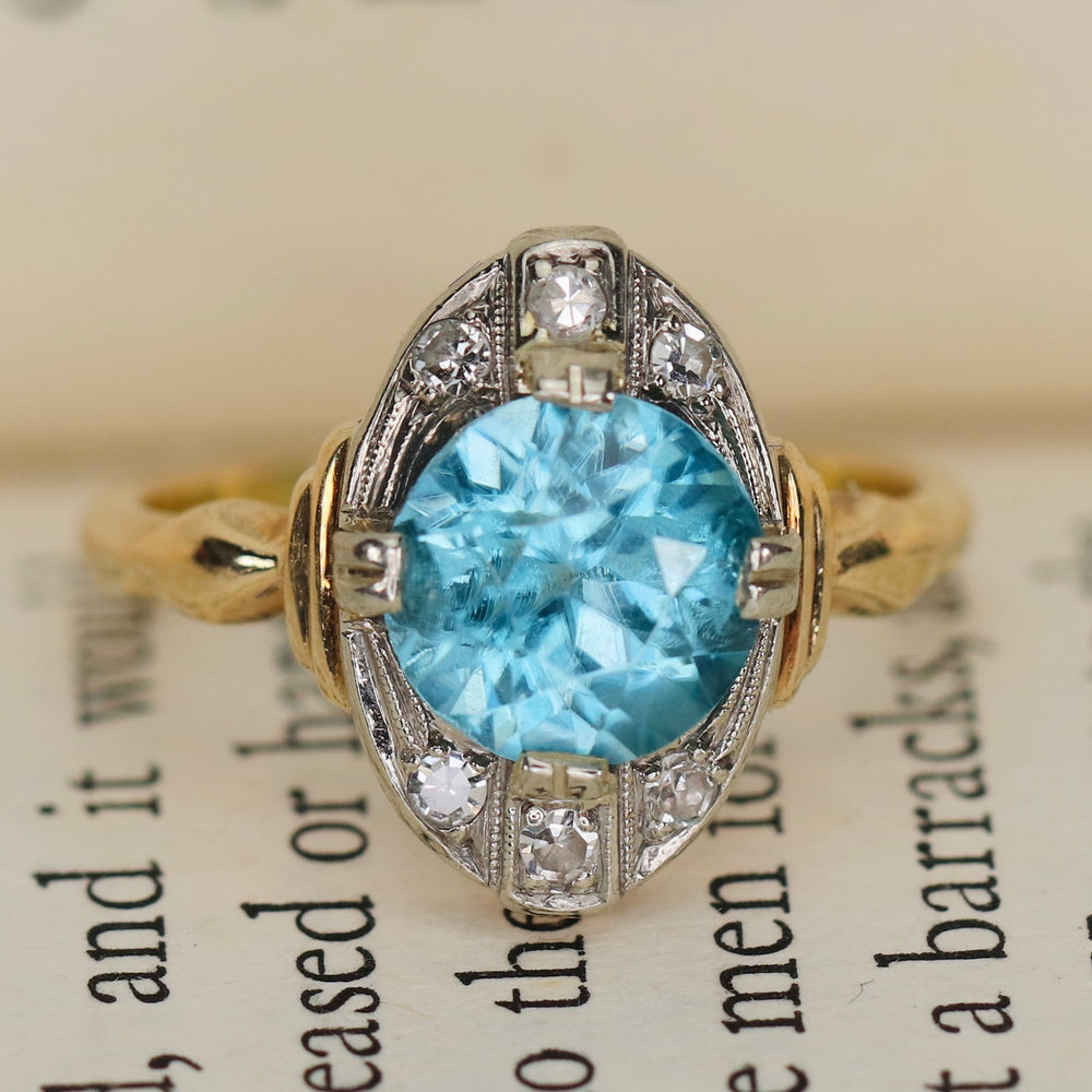Vintage ring with blue zircon and diamonds in yellow and white gold