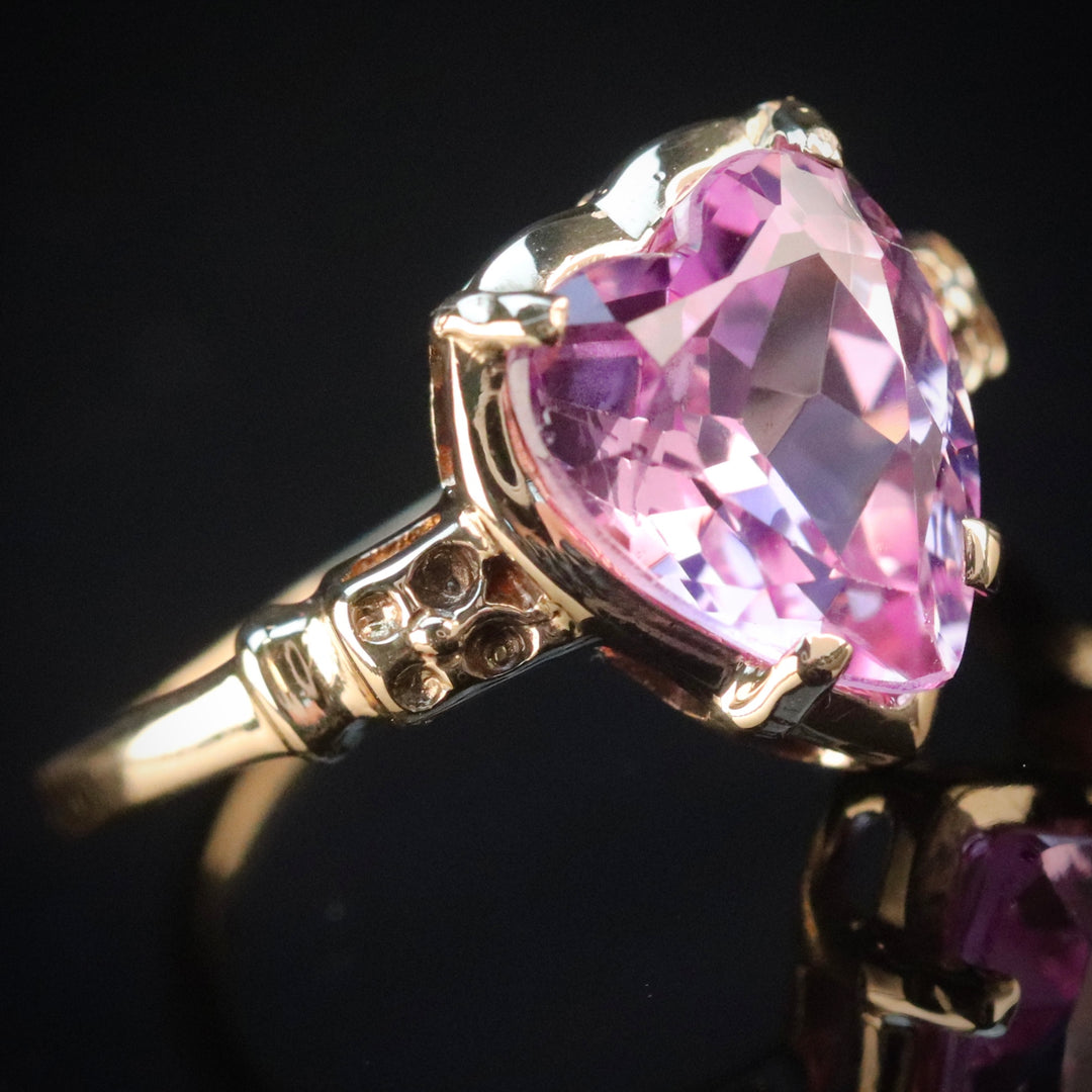 Vintage ring with synthetic pink sapphire heart in yellow gold from Manor Jewels.