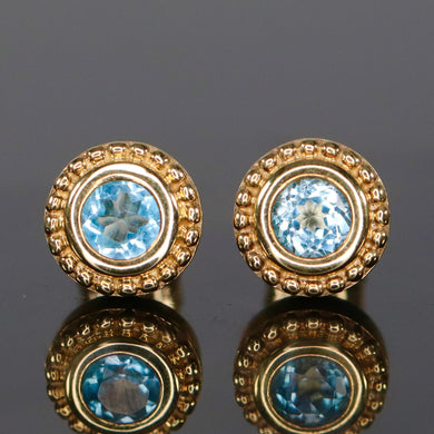 CLEARANCE!  Blue topaz studs in yellow gold