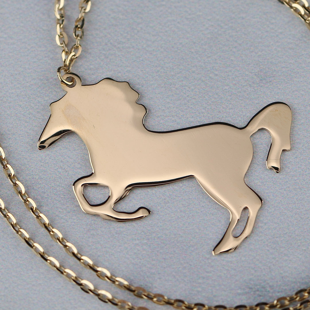 Horse necklace in 14k yellow gold