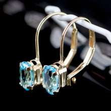 Load image into Gallery viewer, Blue topaz leverback earrings in yellow gold