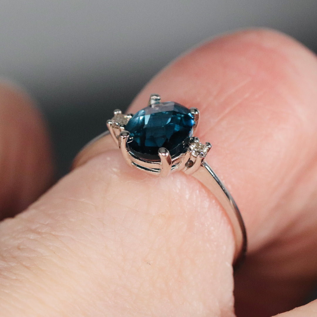 Blue topaz and diamond ring in 14k white gold