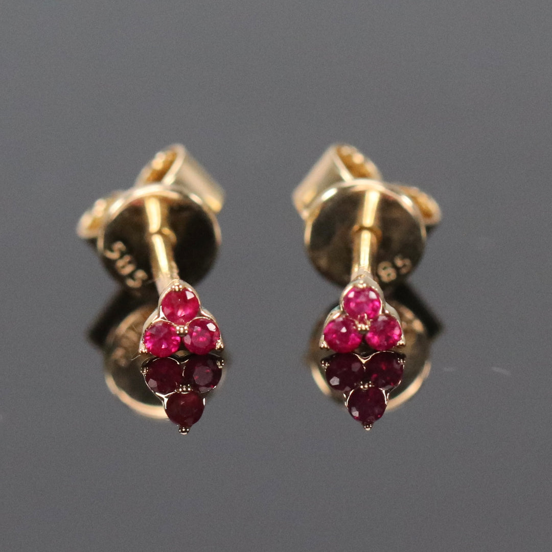 Dainty ruby studs in 14k yellow gold
