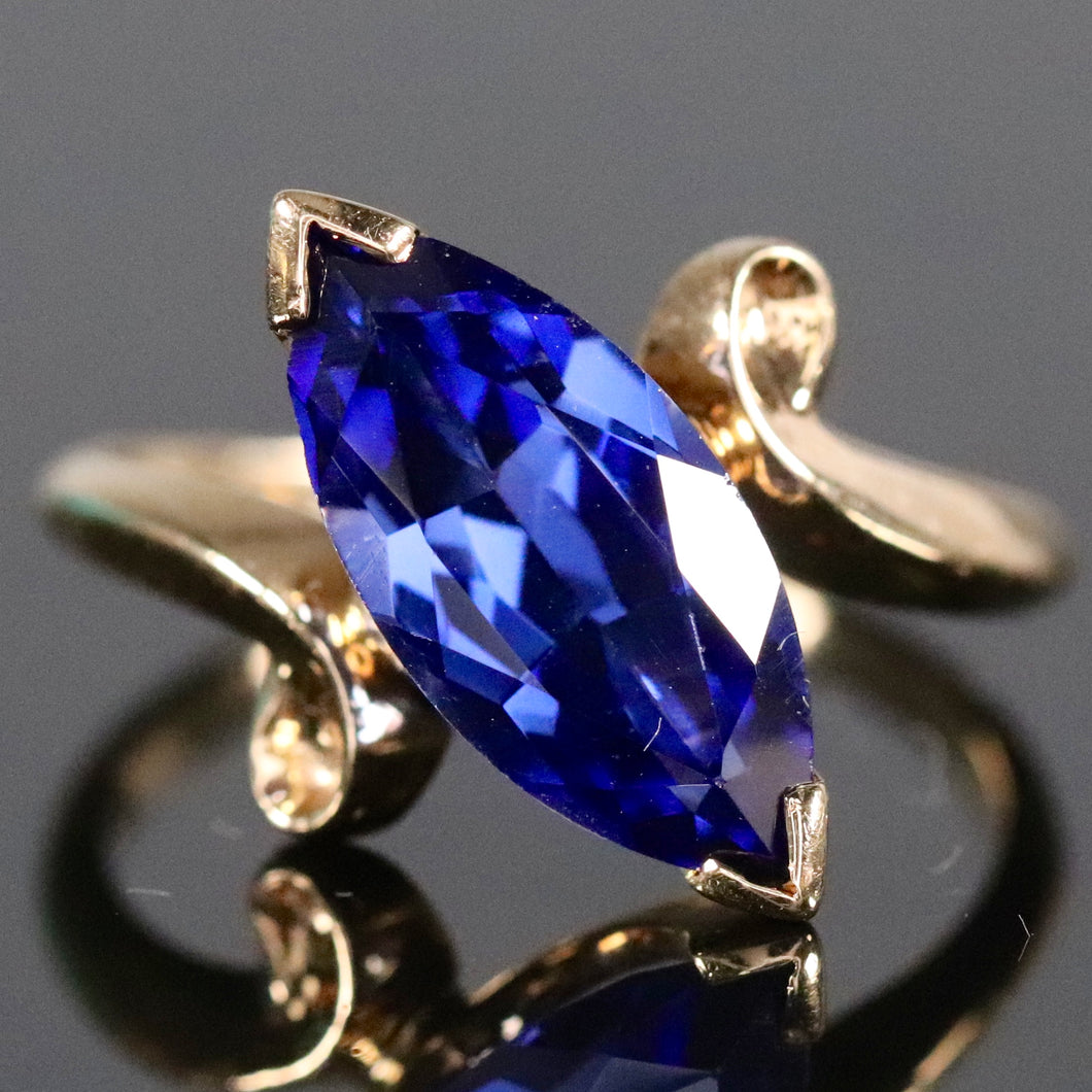 Marquise cut synthetic blue sapphire ring in yellow gold