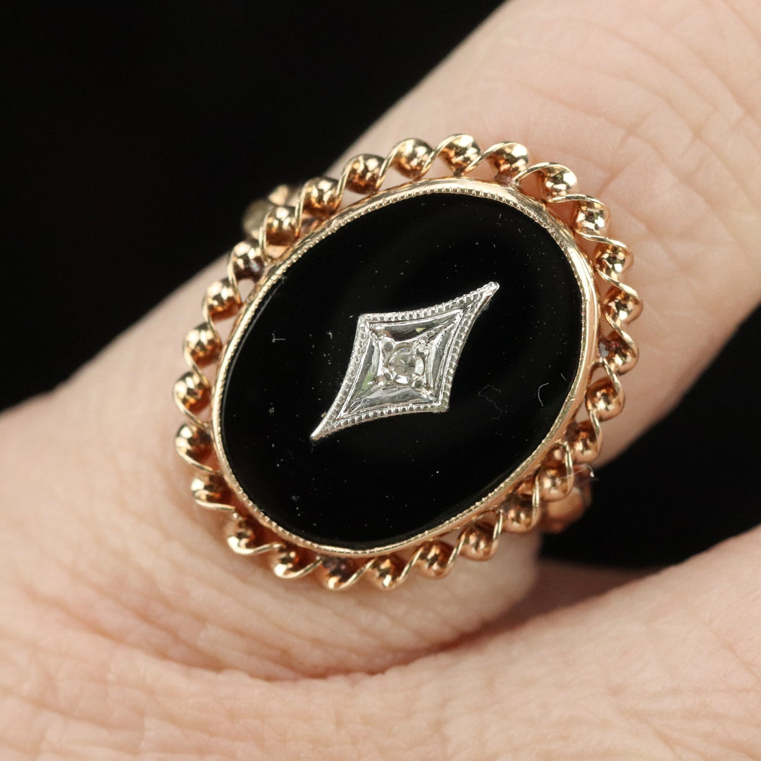 Classic vintage onyx and diamond ring in yellow gold