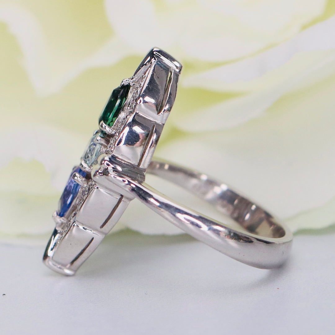 Estate platinum navette ring with diamonds, aquamarine, tanzanite, and tourmaline in platinum from Manor Jewels