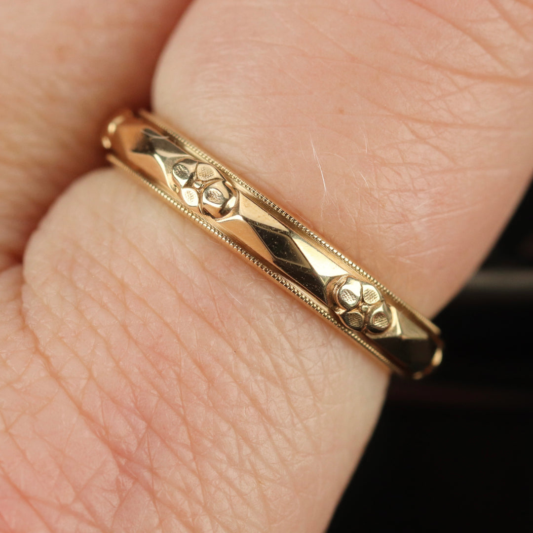 Vintage gold band ring with orange blossom pattern by Art Carved from Manor Jewels.