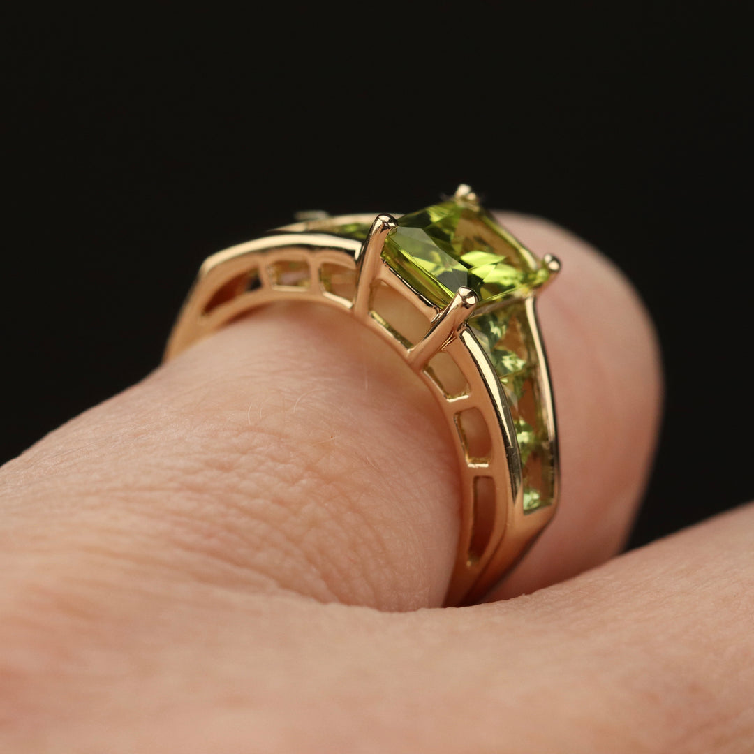 Peridot 7 stone ring in 14k yellow gold