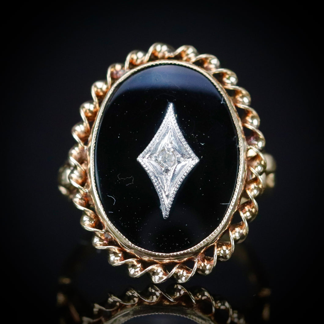 Classic vintage onyx and diamond ring in yellow gold