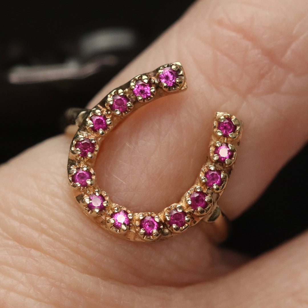Vintage ring with synthetic rubies in a horseshoe shape in yellow gold