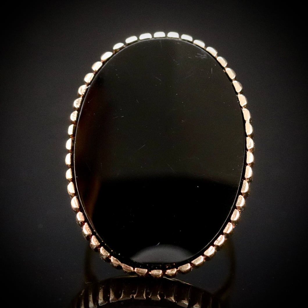 Vintage onyx ring with large oval onyx in 14k yellow gold from Manor Jewels.
