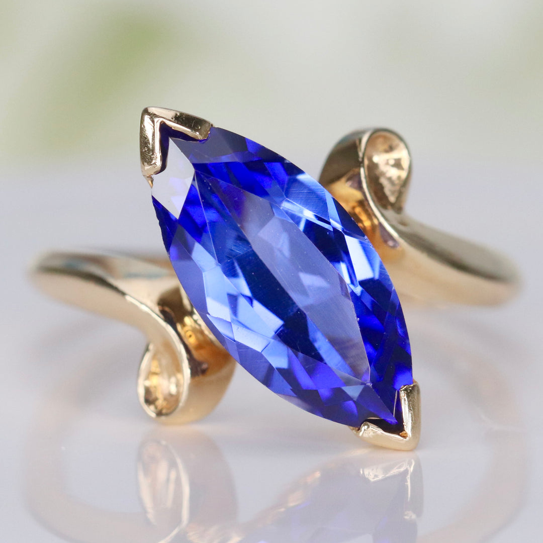 Marquise cut synthetic blue sapphire ring in yellow gold