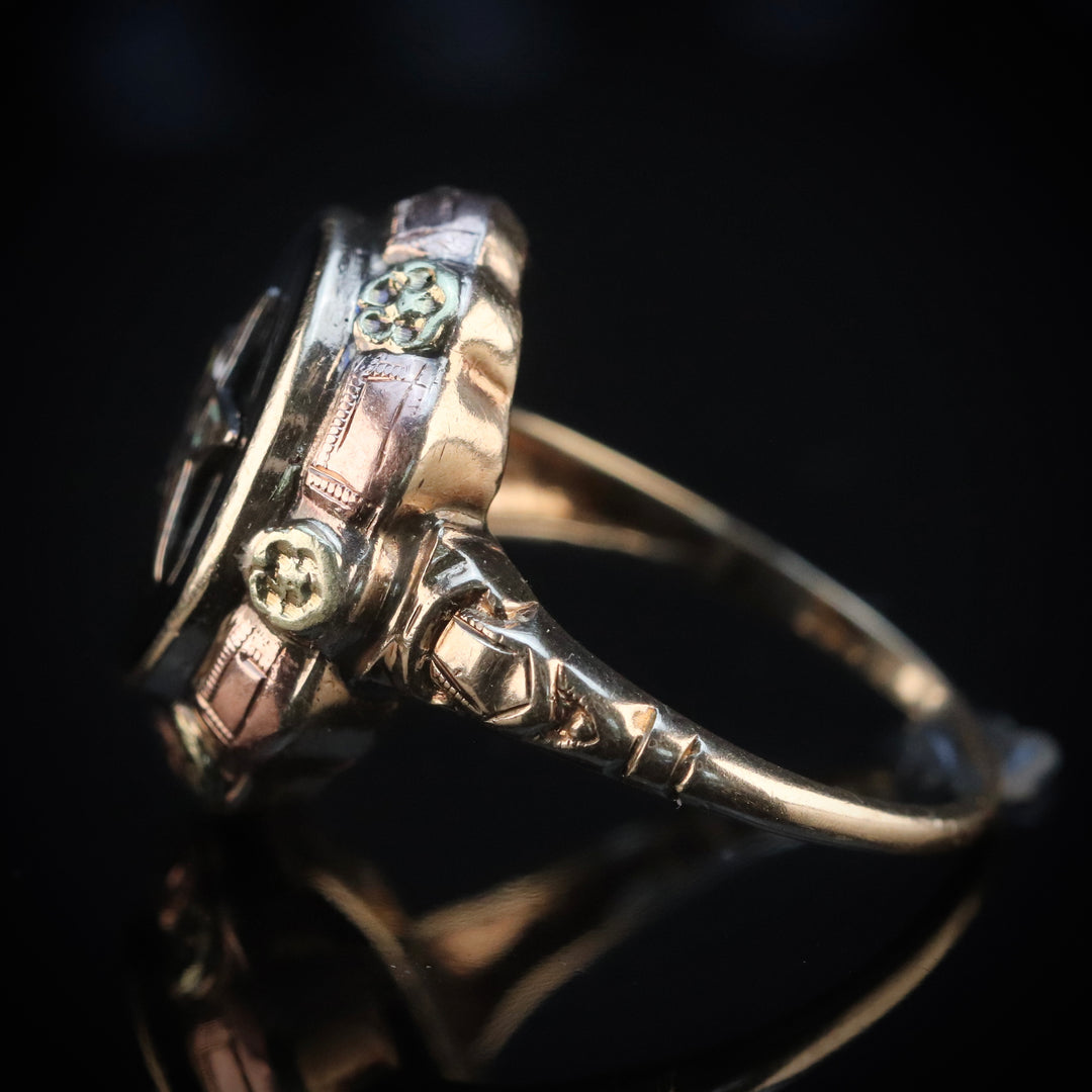 Vintage onyx ring with eastern star motif in tri color gold from Manor Jewels.