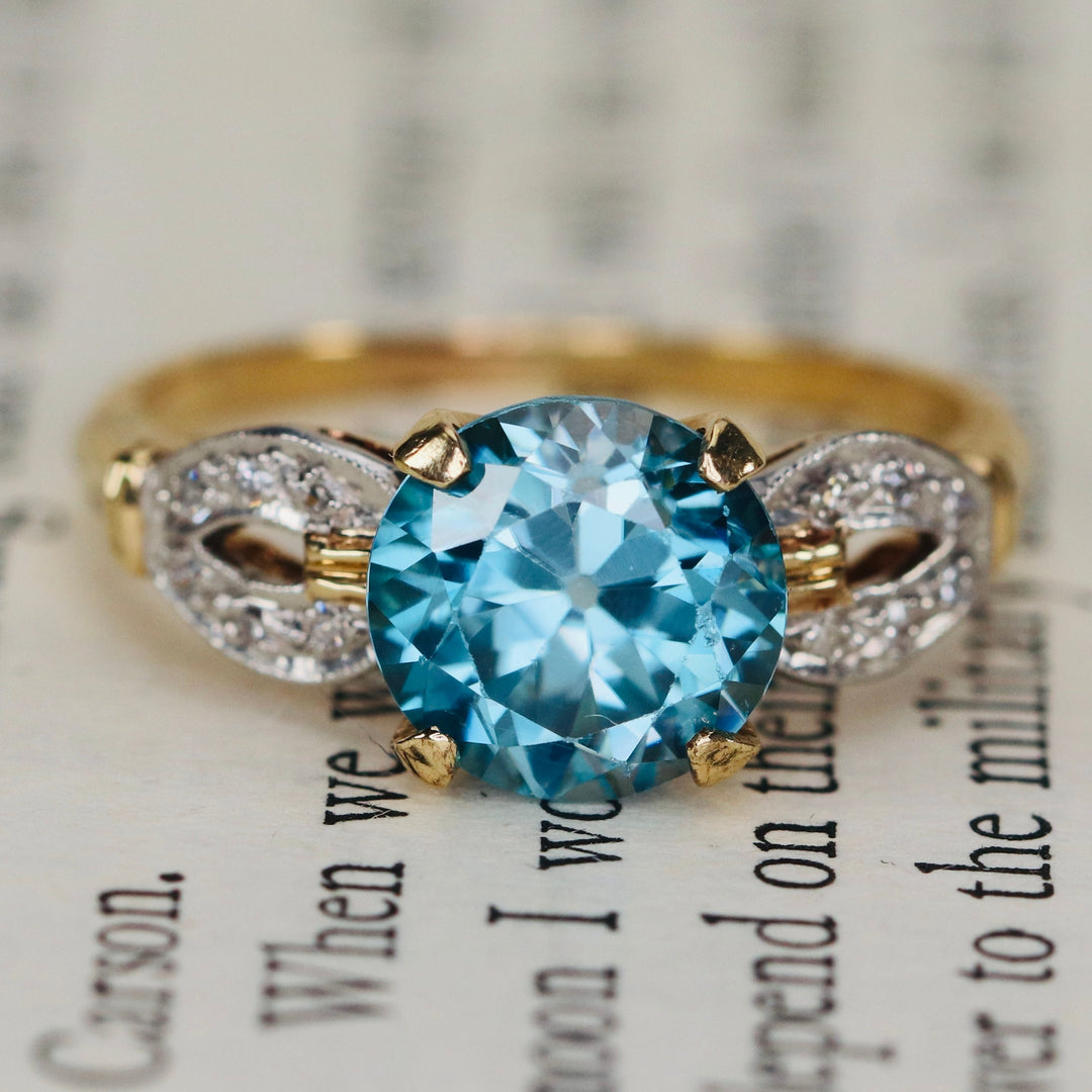 Vintage ring with blue zircon and diamonds in 14k yellow gold