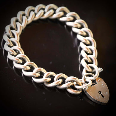 Vintage curb bracelet with heart padlock in yellow gold
