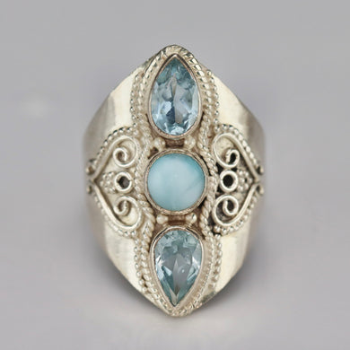 Sterling silver laminar and blue topaz ring