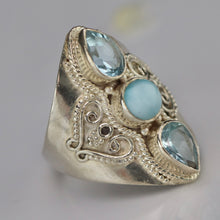 Load image into Gallery viewer, Sterling silver laminar and blue topaz ring