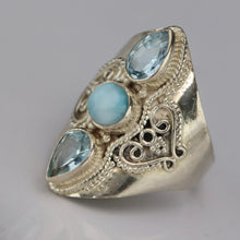 Load image into Gallery viewer, Sterling silver laminar and blue topaz ring