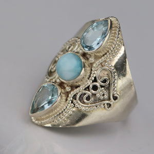 Sterling silver laminar and blue topaz ring