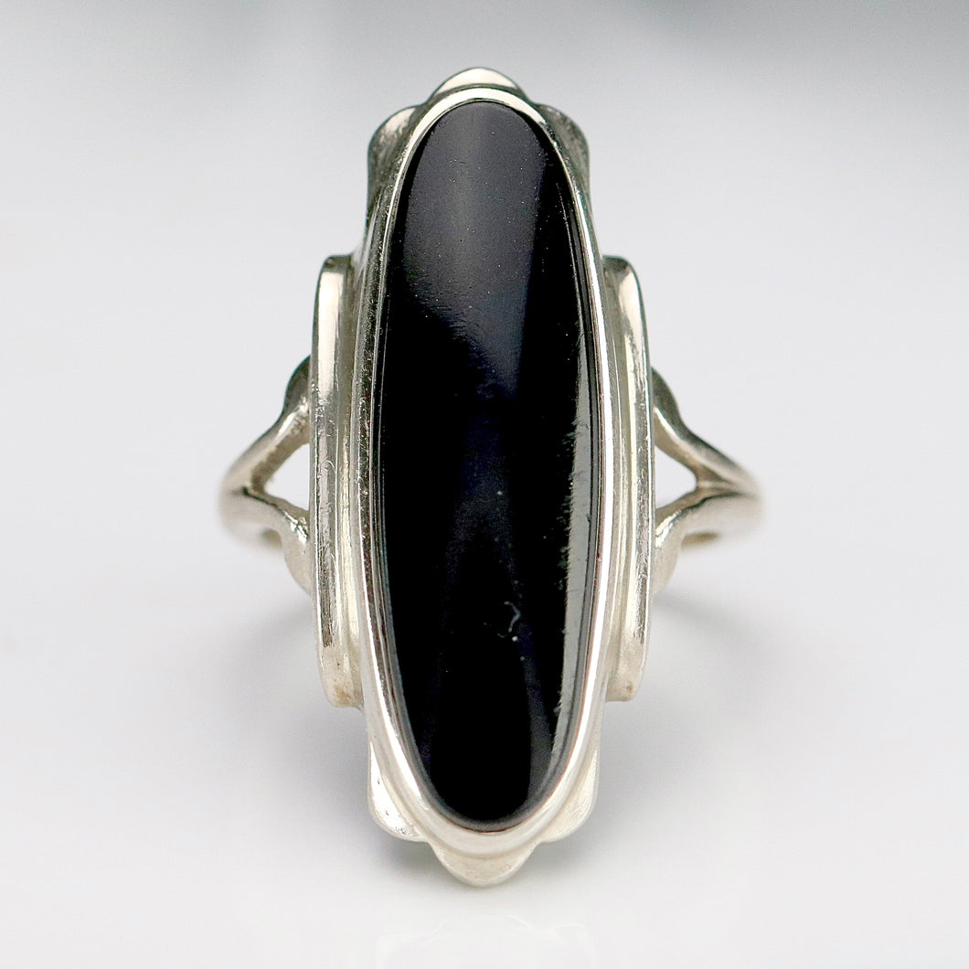 Estate vintage long and lean oval onyx vintage ring in white gold