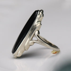 Estate vintage long and lean oval onyx vintage ring in white gold