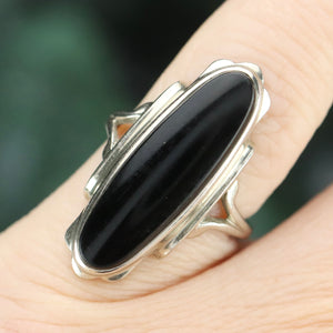 Estate vintage long and lean oval onyx vintage ring in white gold