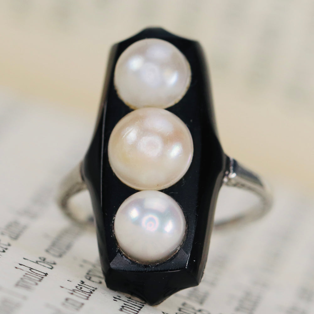 Vintage onyx and pearl ring in platinum