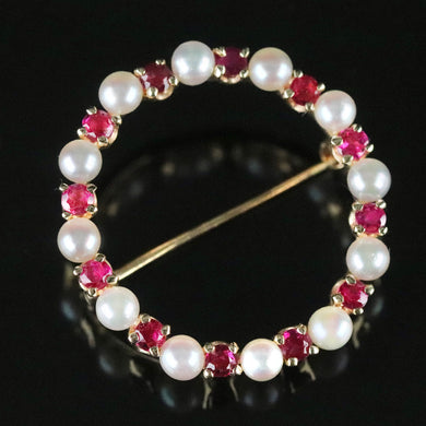 Ruby and pearl wreath brooch in 14k yellow gold