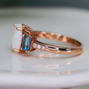 Opal and blue topaz ring in rose gold