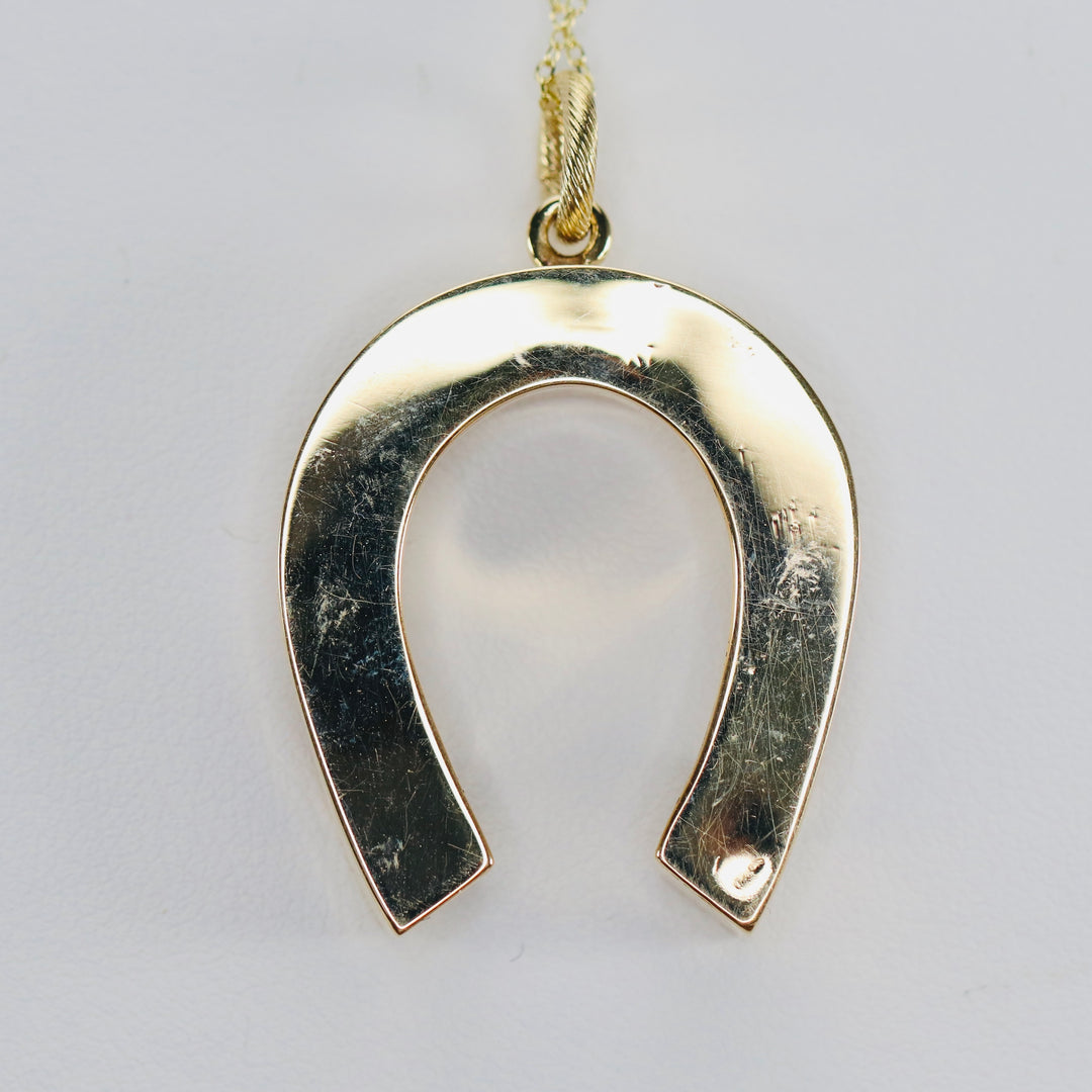 Estate vintage horseshoe necklace in yellow gold